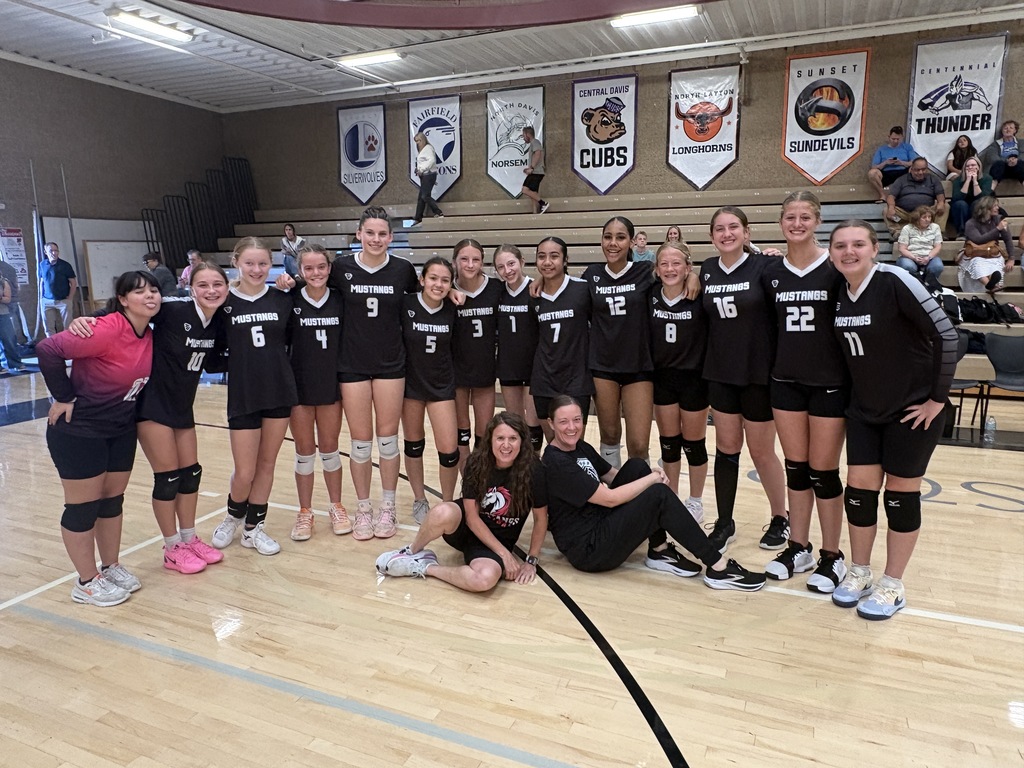 Girls volleyball team with coaches