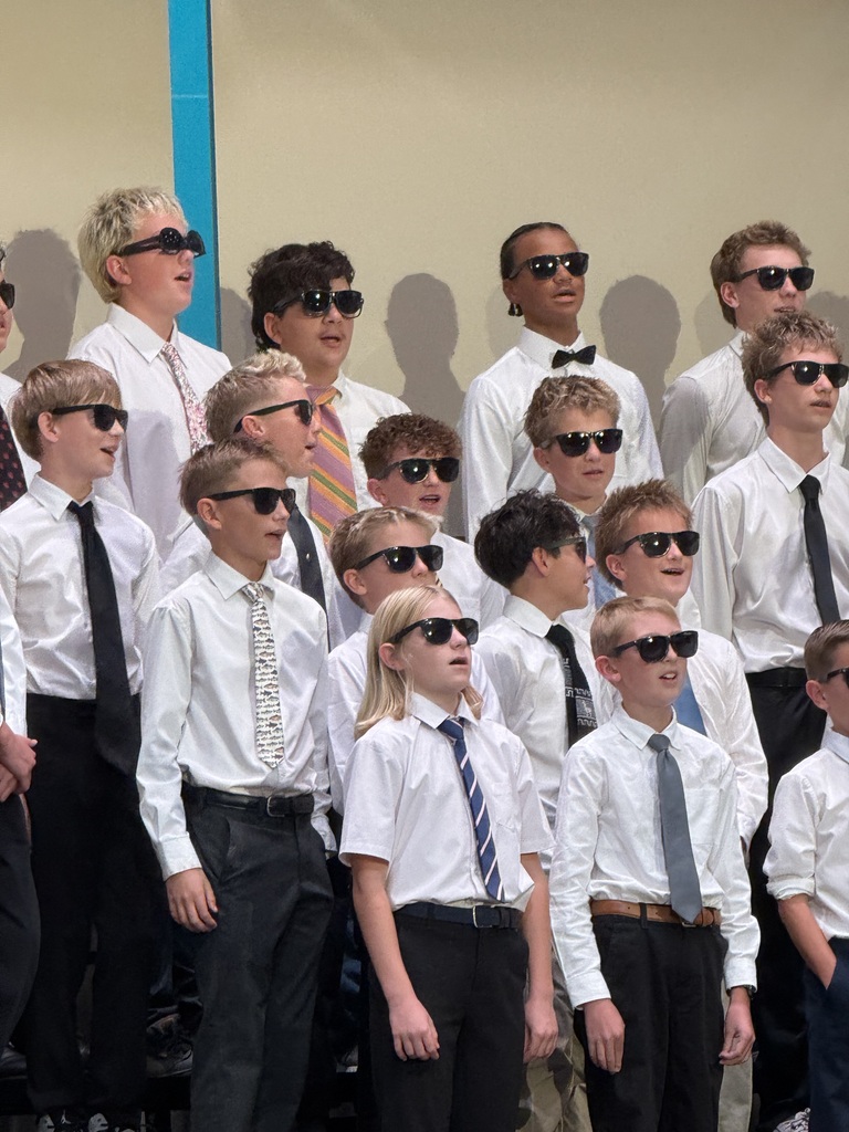 Students perform wearing sunglasses. 