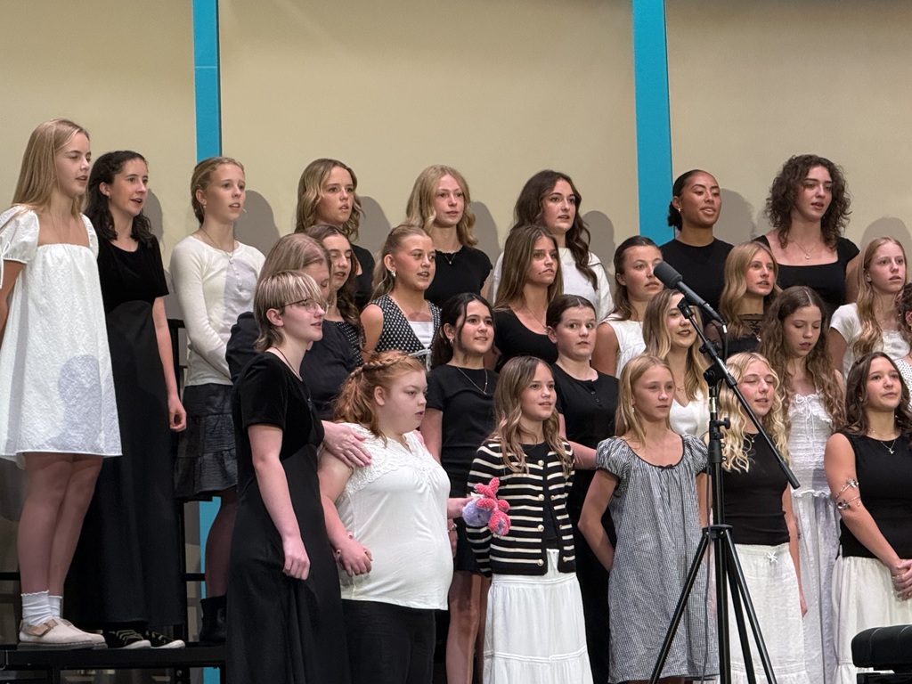 Female students singing. 