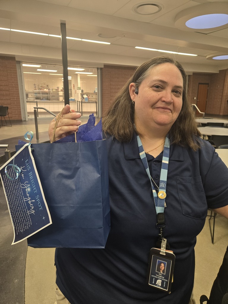 Ms. Youngberg posing with her bright spot award