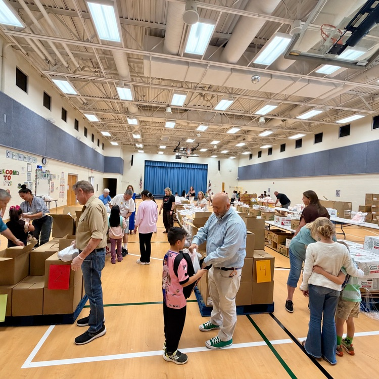 Lincoln students receive bags of groceries from the Utah Food Bank  