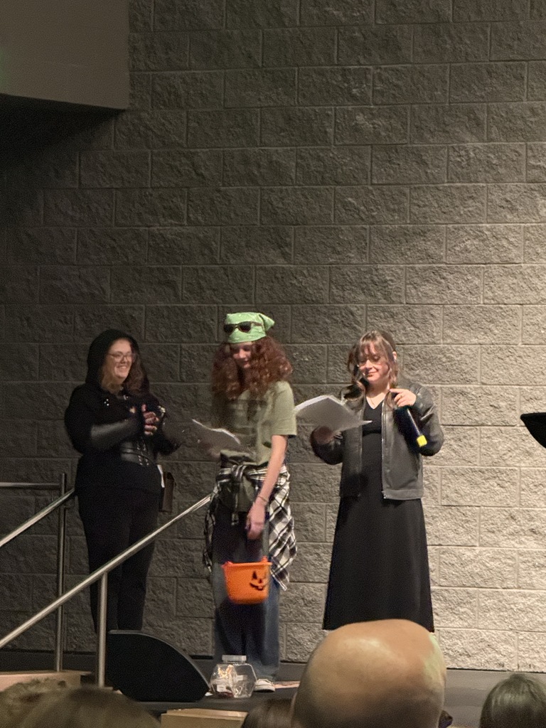 Announcing prices and shout-outs at the concert this evening. 