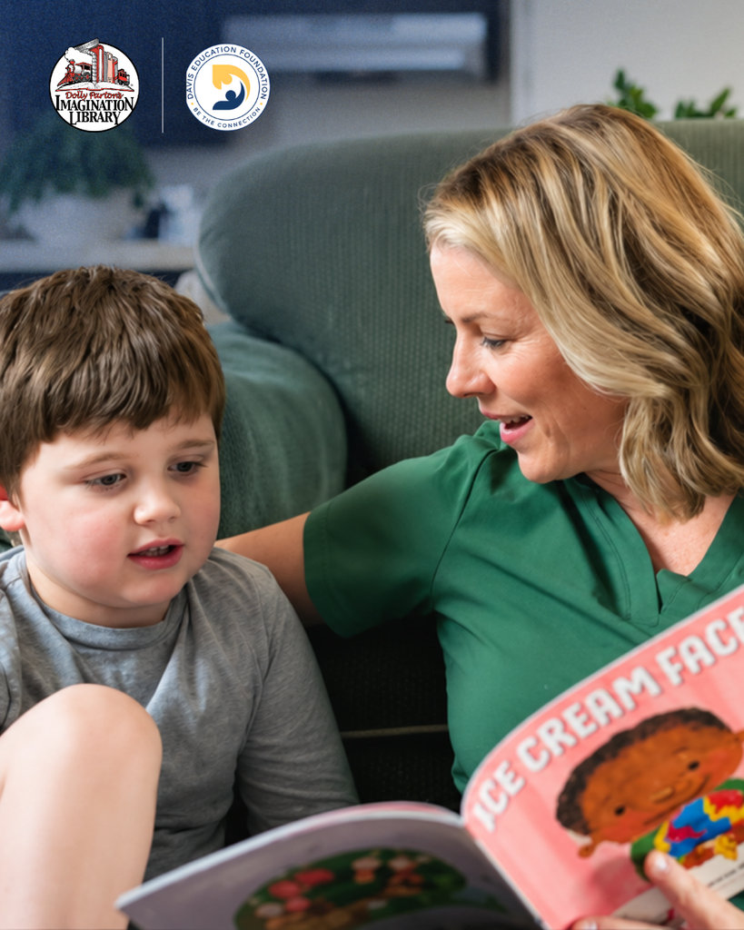 A parent reading to a student. In collaboration with Dolly Parton's Imagination Library and Davis Education Foundation.
