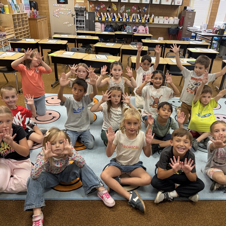 1st graders showing off their hands during the experiment 