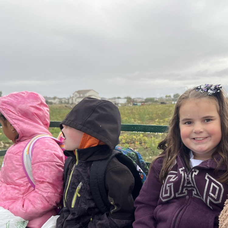 student on tractor ride at field trip
