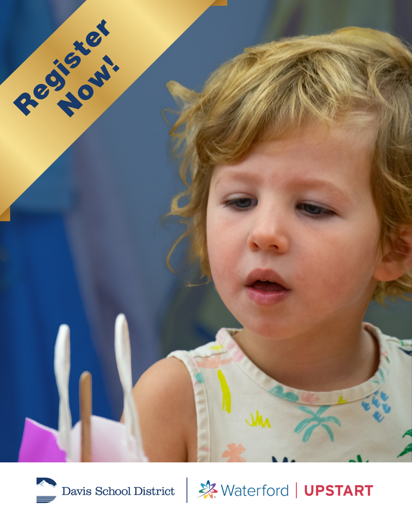 A young student looking in awe. Davis School District is partnering with Waterford Upstart - Register Now!