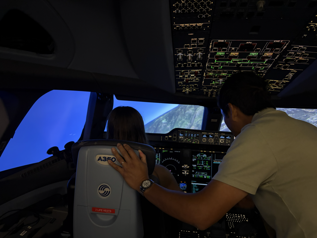 female student pilot learns from professional Delta Airlines pilot