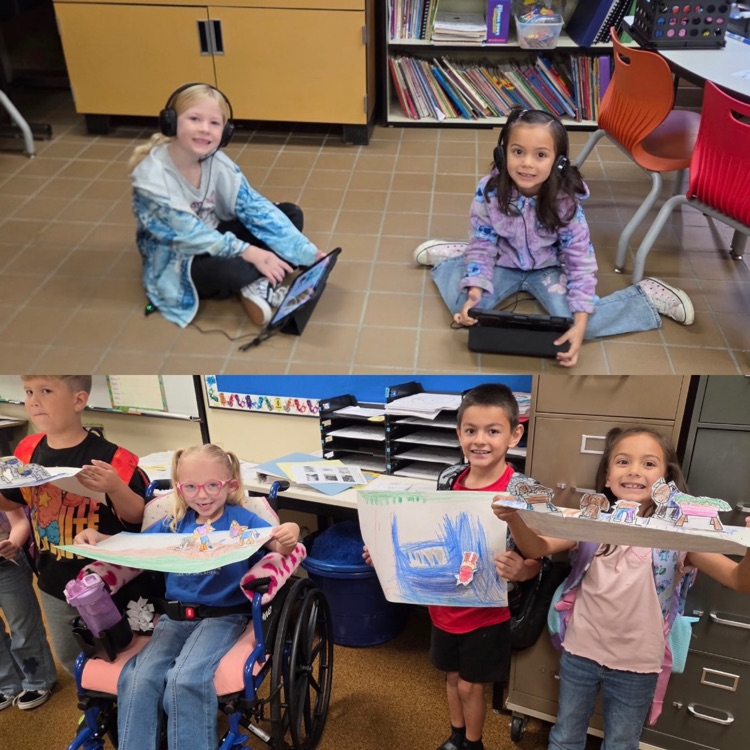 1st graders reading during class and showing their projects they created