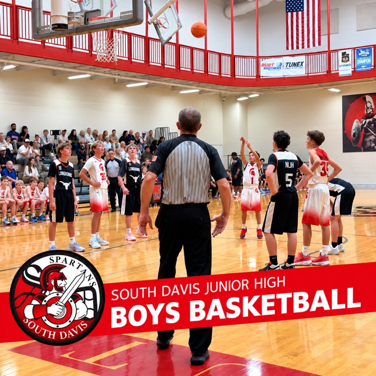 Boys basketball game at South Davis Junior High, featuring a red banner with the school logo and “Boys Basketball” text.