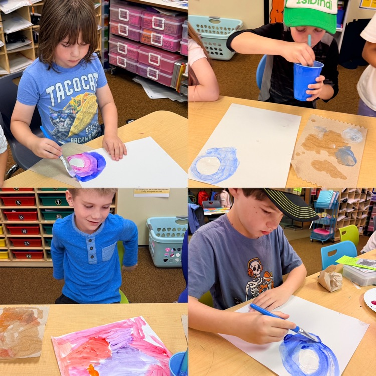 students painting a sky background 