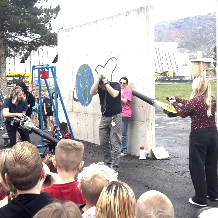 The principal caught in a leaf blower tornado  