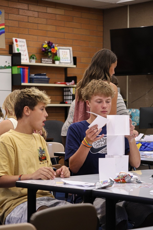 Students building a paper tower.