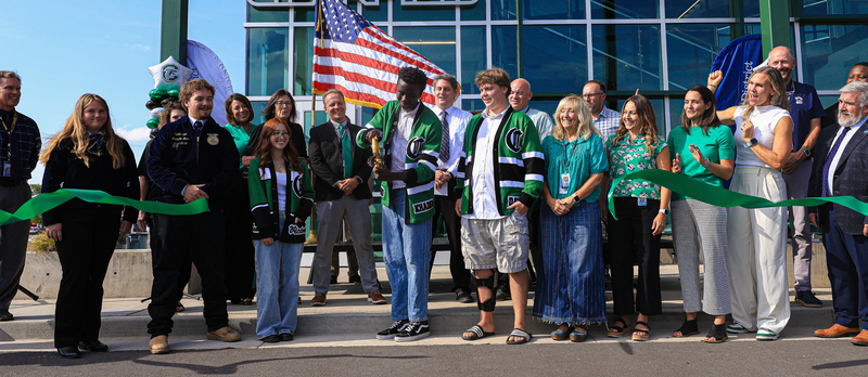 A student cuts the ribbon to open the new Clearfield High CTE Building