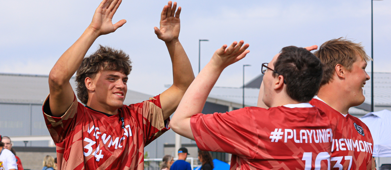 Students celebrating after making a goal.