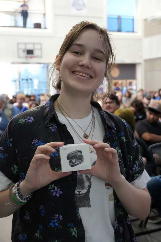 Student holding their winnings from the Recognition assembly