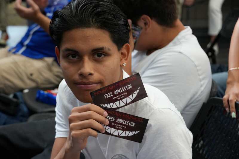 Student holding tickets that were rewarded at Recognition Assembly