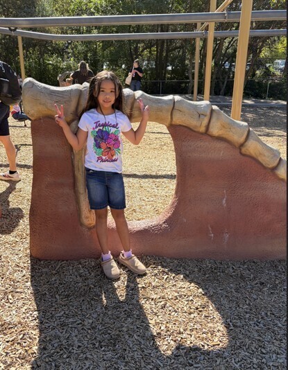 One student poses on the playground.