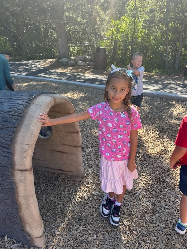 One student poses on the playground.