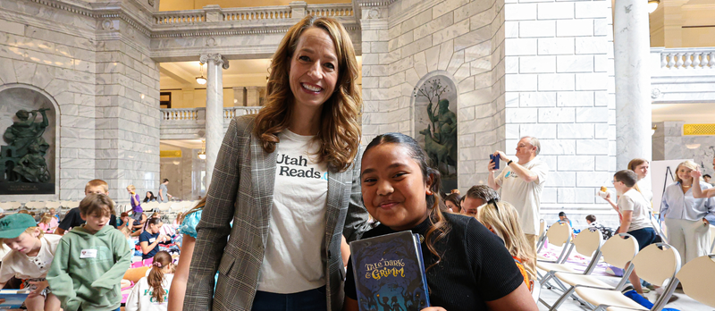 A student and First Lady Abby Cox during the Utah Reads Read-A-Thon