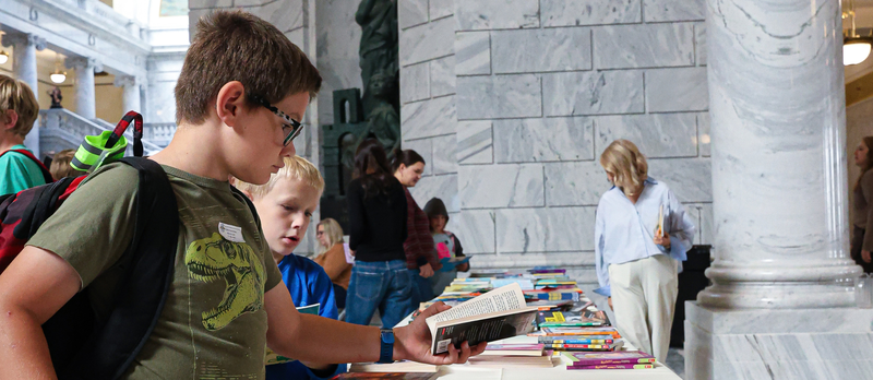 Students choosing books at the Utah Reads Read-A-Thon event at the Utah State Capitol