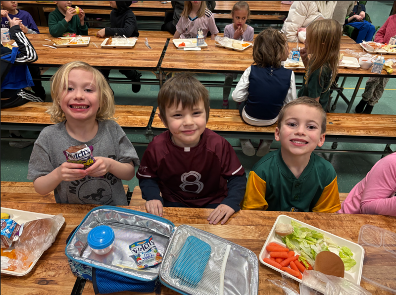 Image of students eating lunch at school. 