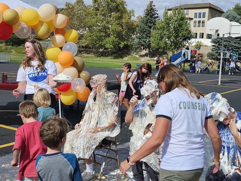 Principal, Vice Principal and PE coach getting pied in on the playground watched by students