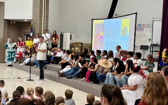 Mr. Tomsik and Hispanic students and staff