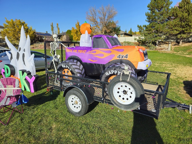 Blowup monster truck on a trailer with skeletons
