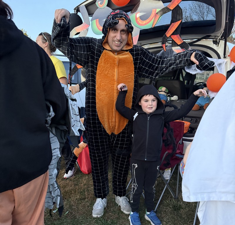 Mr. Ben dressed as a spider with his student