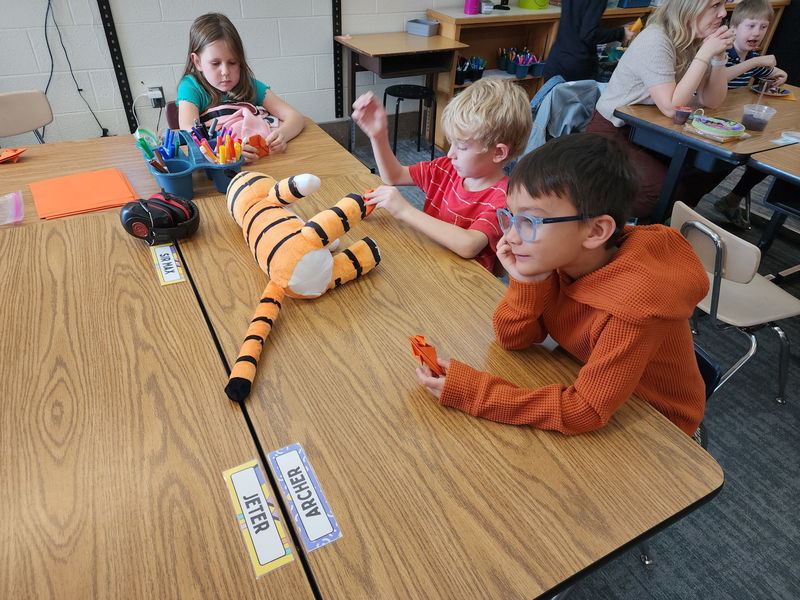 Students doing an art activity for Halloween.