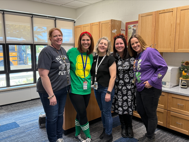 Office staff dressed up for Halloween