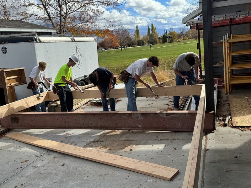 students starting to build the foundation of home #5 for the other side village