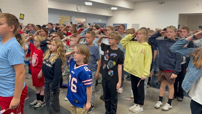 students learning to salute