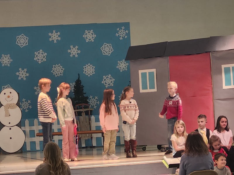 Students performing on the stage.