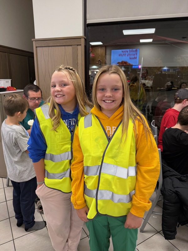 Students helping deliver food to customers