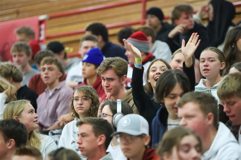 two kids waving at the camera