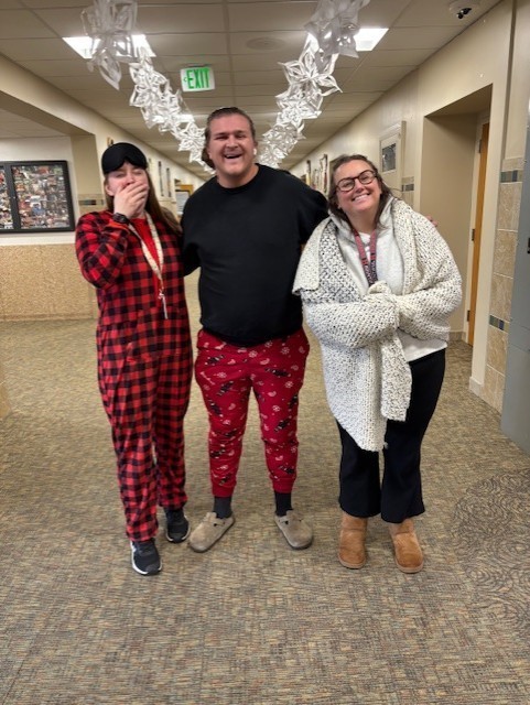 Three teachers dressed in pajamas on pajama day