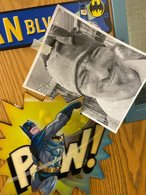 Copy picture of Pinky's face being punched by a Batman sticker with the word POW