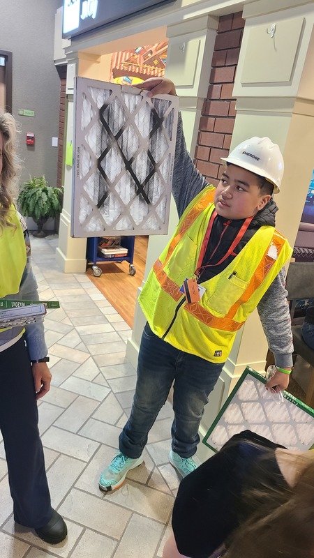 Students at JA City, a work simulation experience.