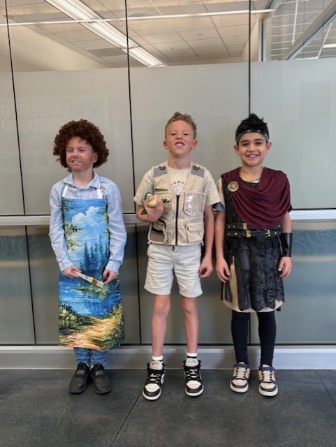 Students dressed in costume as historical figures 