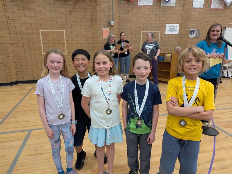 3rd grade students on the Book Battle team, Chaos Kittens with 2nd place medals