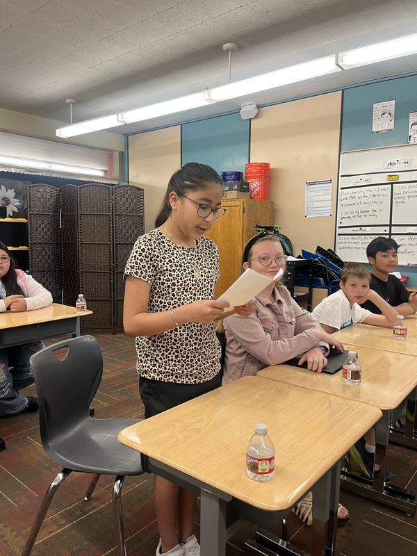 A student giving her speech to the judges