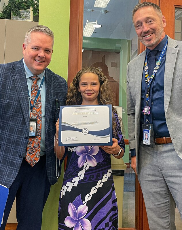 4th grade student with the superintendent and Mr. Nash