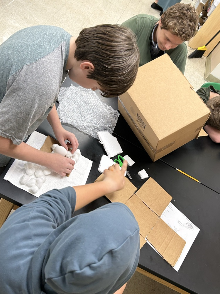 Students creating egg structure 