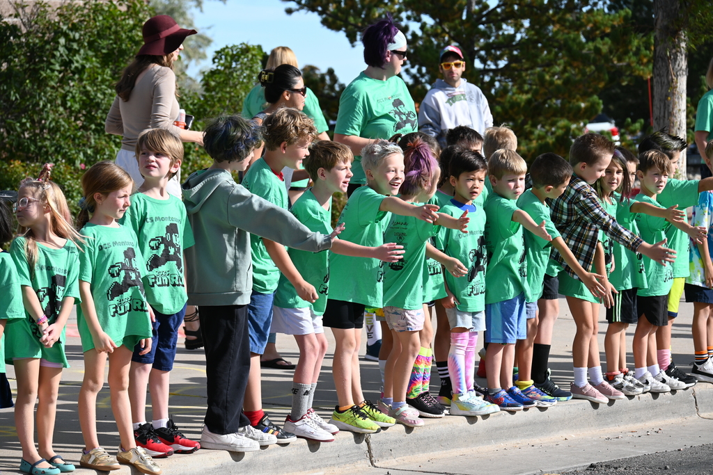 students cheering on others