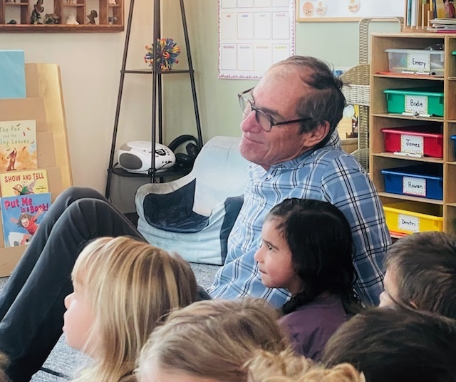 Grandparent listening to a story with children