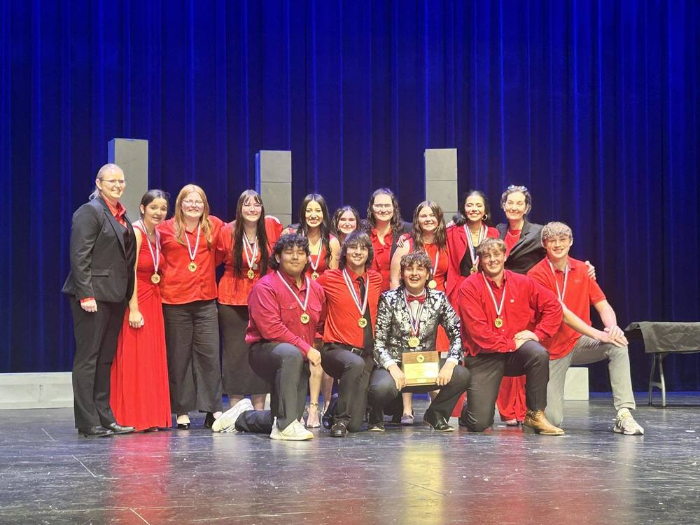 OAP group picture on stage at regionals