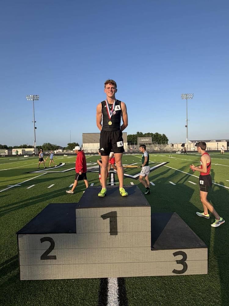 gold medal winning sr max jones standing on podium
