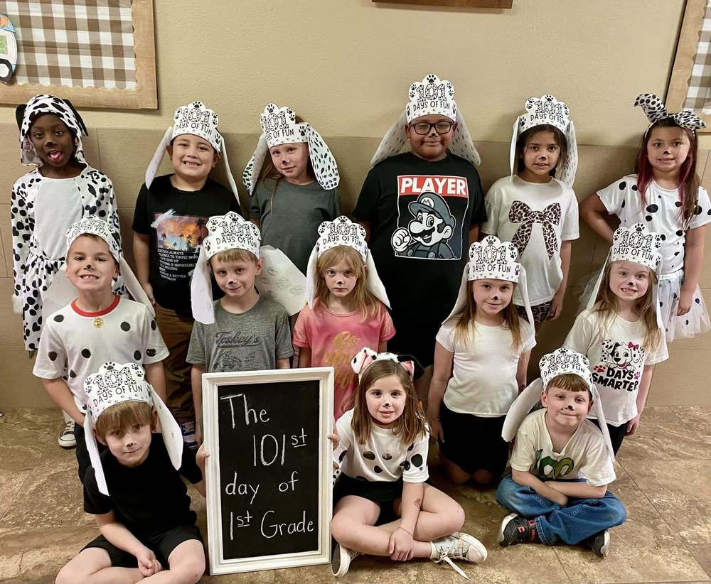 group of students dressed as dalmatians posing to picture