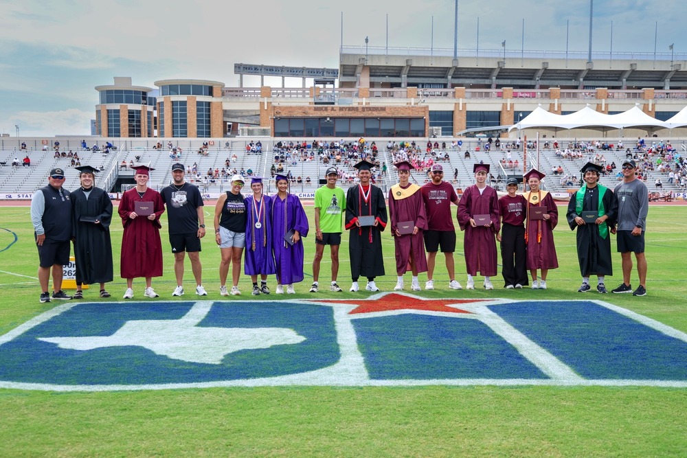 uil state track meet graduates and coaches standing on field